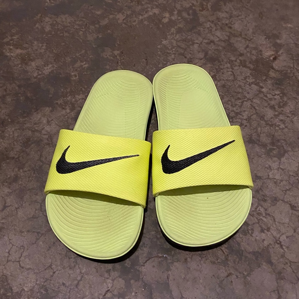 Neon yellow Nike sandals